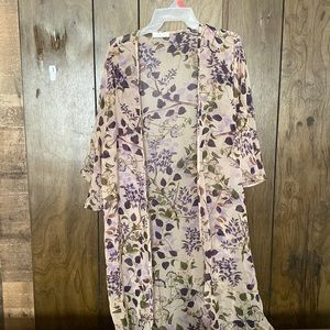 This is a floral shaw size medium and fits very comfortably and loose